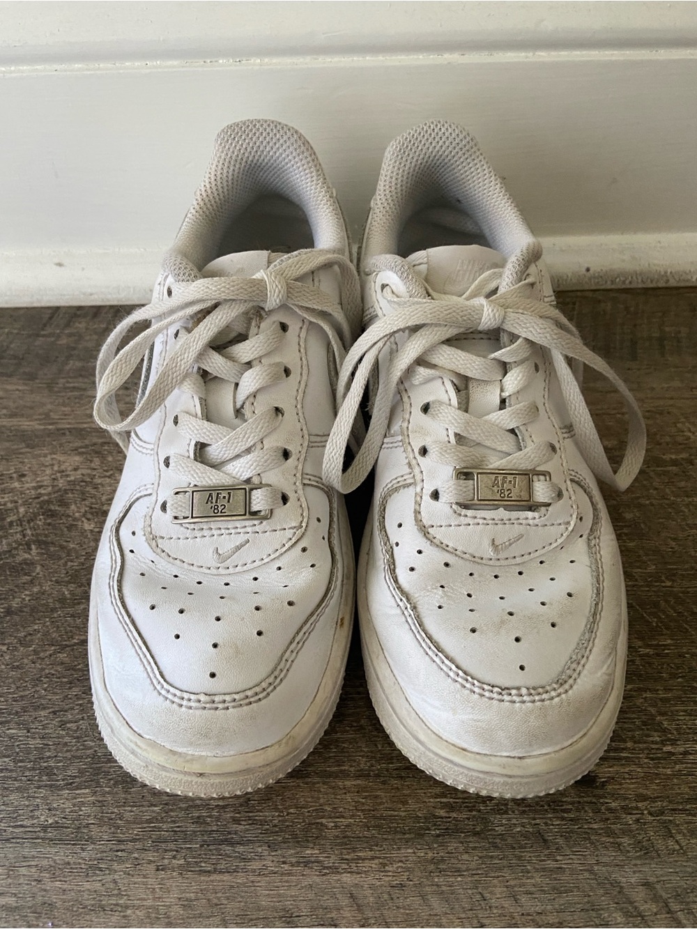 Kids White Nike Air Force Ones Athletic Sneakers - Classic Low-Top Style
